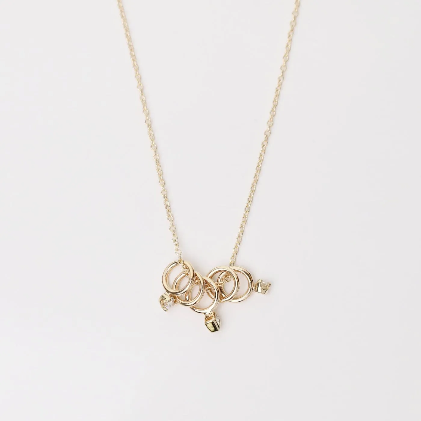 14k Gold 5 Tiny Rings Necklace with Mixed Diamonds