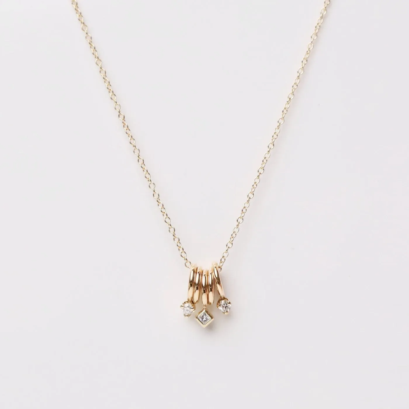 14k Gold 5 Tiny Rings Necklace with Mixed Diamonds